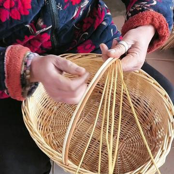 Artisan hands weaving wicker traditional technique