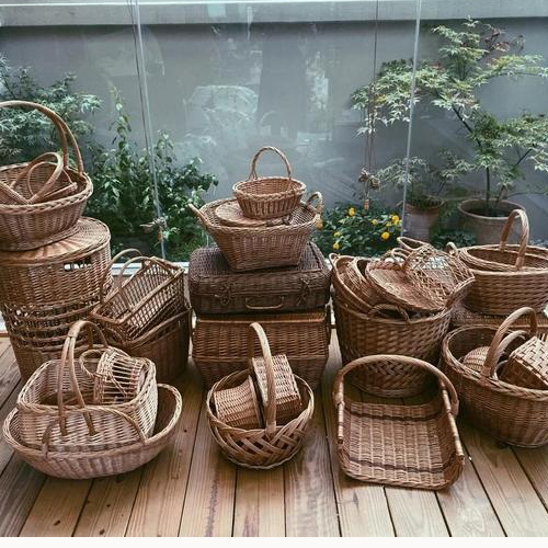 Finished wicker straw and fabric crafts arranged